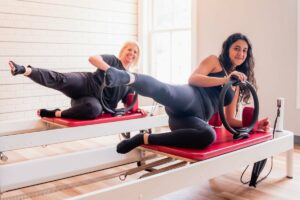 Northern VA women taking reformer pilates class