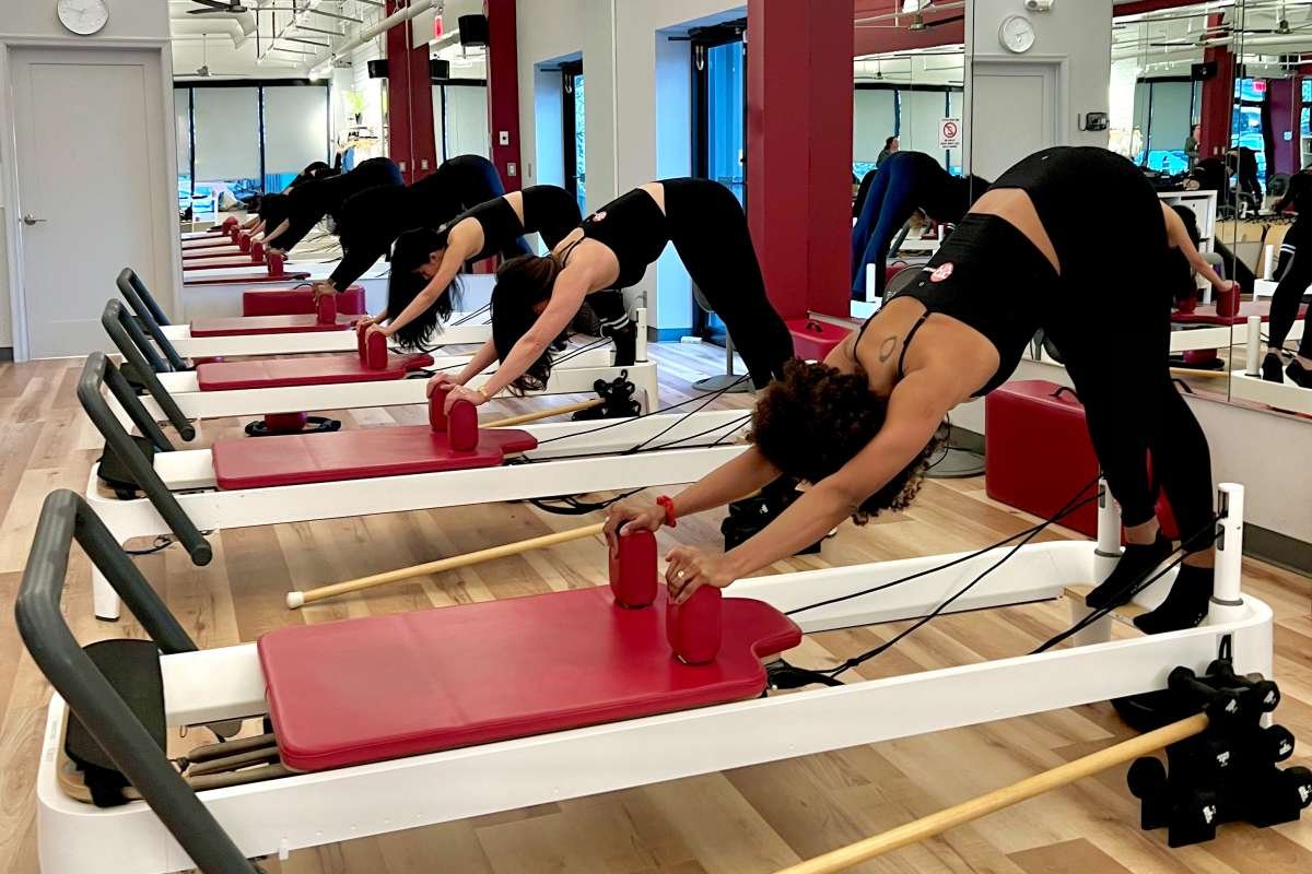 DC Pilates class doing Stretch downdog