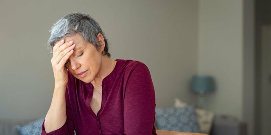 stressed senior woman with pre menopause at home